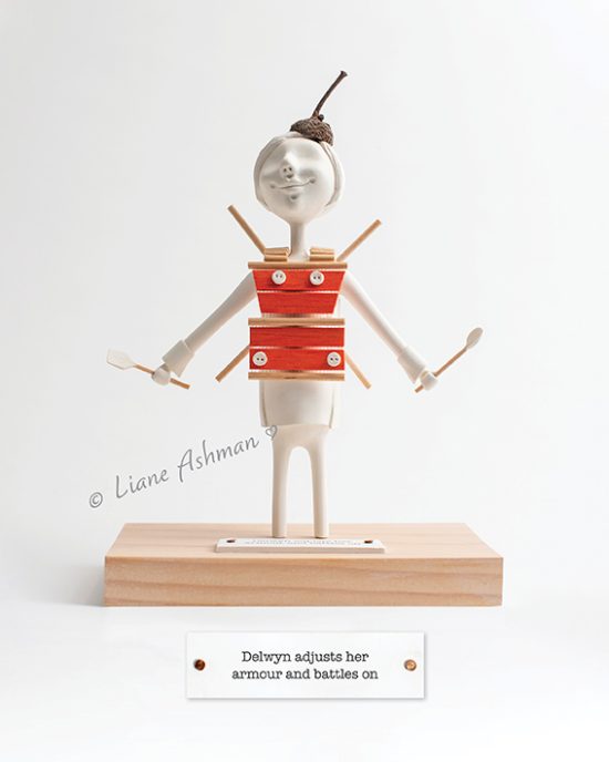 Delwyn adjusts her armour and battles on